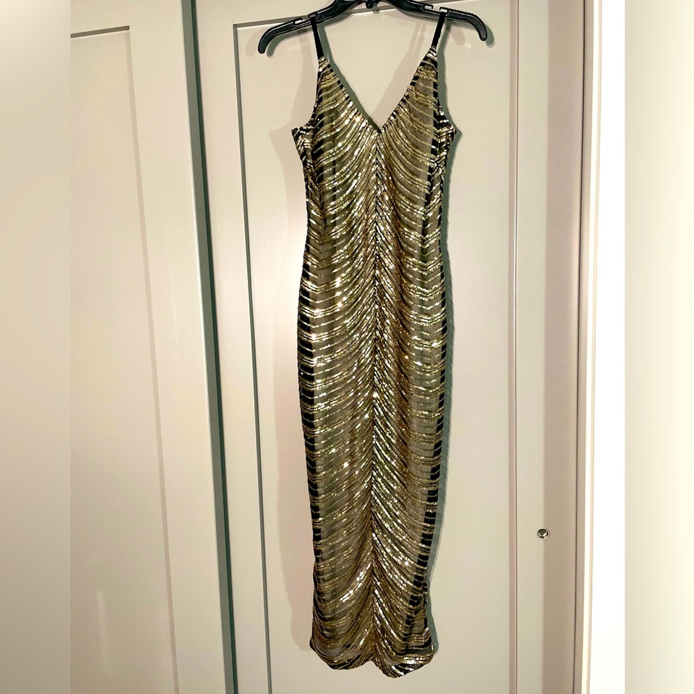 Black and gold sequence dress
